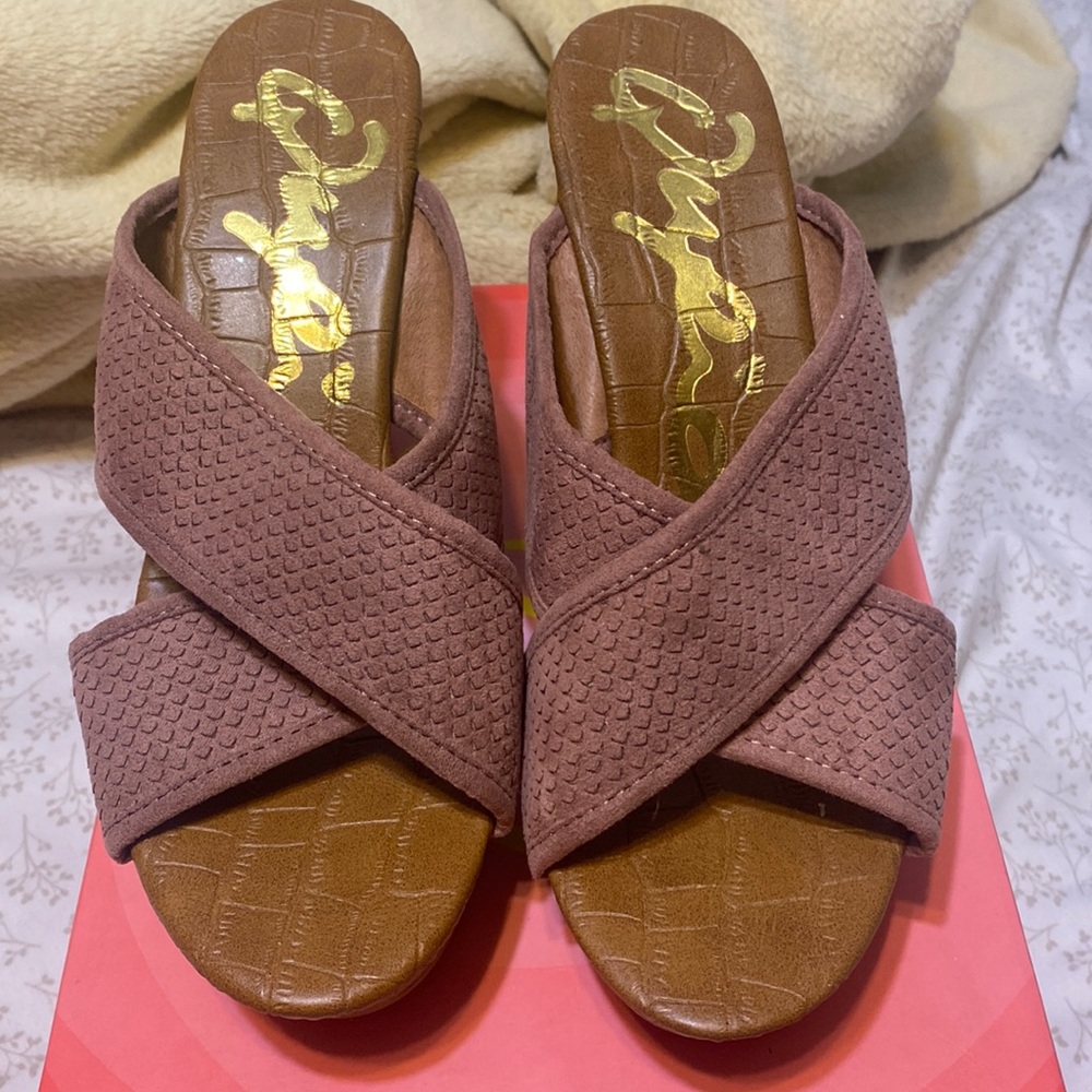 Blush pink color. New, never worn wedges. Size 8.